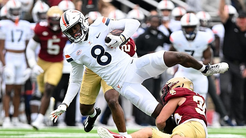 Sep 30, 2023; Chestnut Hill, Massachusetts, USA; Virginia Cavaliers wide receiver Malachi Fields (8) is tackled by Boston College Eagles defensive back John Pupel (35) during the first half at Alumni Stadium. Mandatory Credit: Brian Fluharty-USA TODAY Sports