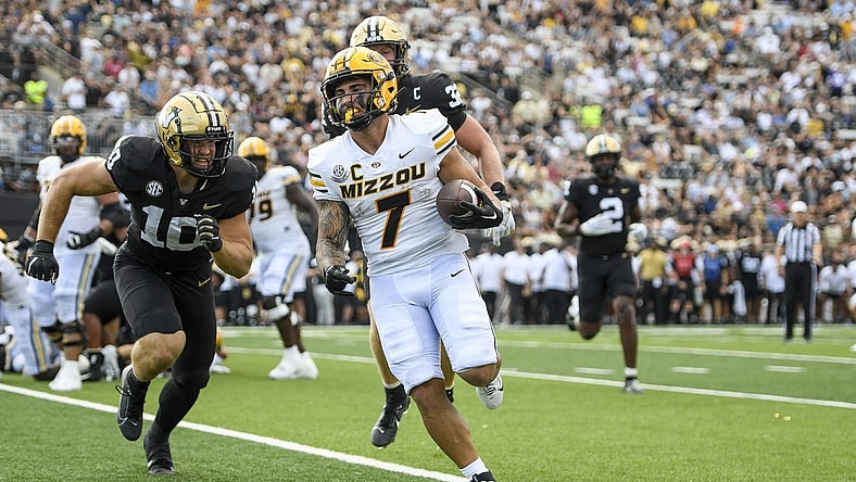 Sep 30, 2023; Nashville, Tennessee, USA; Missouri Tigers running back Cody Schrader (7) scores on a one-yard run against the Vanderbilt Commodores during the first half at FirstBank Stadium. Mandatory Credit: Steve Roberts-USA TODAY Sports