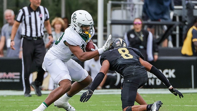 Sep 30, 2023; Orlando, Florida, USA; Baylor Bears tight end Drake Dabney (89) avoids a tackle against UCF Knights defensive back Demari Henderson (8) during the second quarter at FBC Mortgage Stadium. Mandatory Credit: Mike Watters-USA TODAY Sports