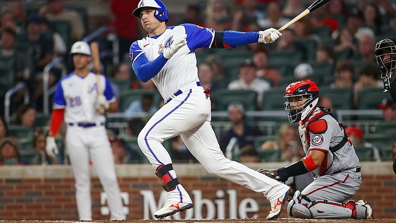 Sep 30, 2023; Atlanta, Georgia, USA; Atlanta Braves third baseman Austin Riley (27) hits a double against the Washington Nationals in the first inning at Truist Park. Mandatory Credit: Brett Davis-USA TODAY Sports