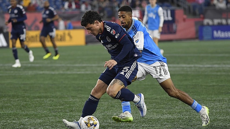 Sep 30, 2023; Foxborough, Massachusetts, USA;  New England Revolution forward Tom s Chancalay (5) and Charlotte FC midfielder McKinze Gaines (17) battle for the ball during the first half at Gillette Stadium. Mandatory Credit: Bob DeChiara-USA TODAY Sports