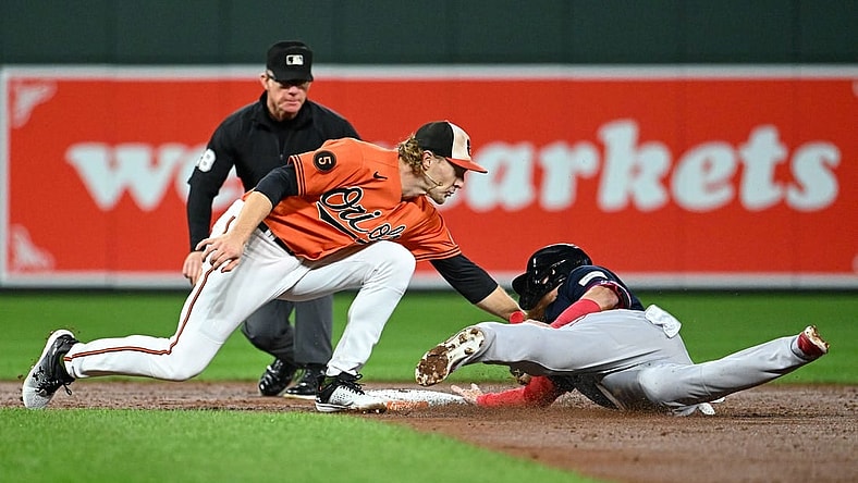 Sep 30, 2023; Baltimore, Maryland, USA; Baltimore Orioles third baseman Gunnar Henderson (2) tags Boston Red Sox designated hitter Justin Turner (2) out on a third inning steal attempt at Oriole Park at Camden Yards. Mandatory Credit: Tommy Gilligan-USA TODAY Sports