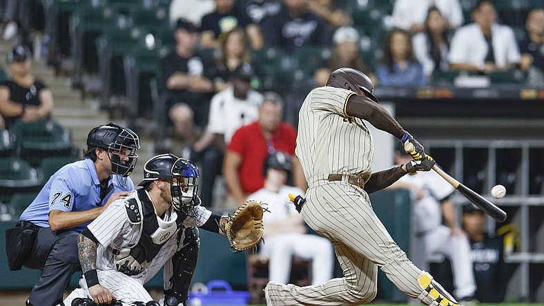 Sep 30, 2023; Chicago, Illinois, USA; San Diego Padres left fielder Juan Soto (22) hits an RBI-double against the Chicago White Sox during the second inning at Guaranteed Rate Field. Mandatory Credit: Kamil Krzaczynski-USA TODAY Sports