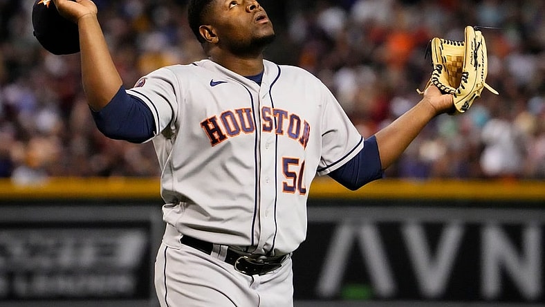 Sep 30, 2023; Phoenix, AZ, USA; Houston Astros relief pitcher Hector Neris (50) reacts after striking out Arizona Diamondbacks Ketel Marte (4) with the bases loaded to end the seventh inning at Chase Field. Mandatory Credit: Rob Schumacher-Arizona Republic