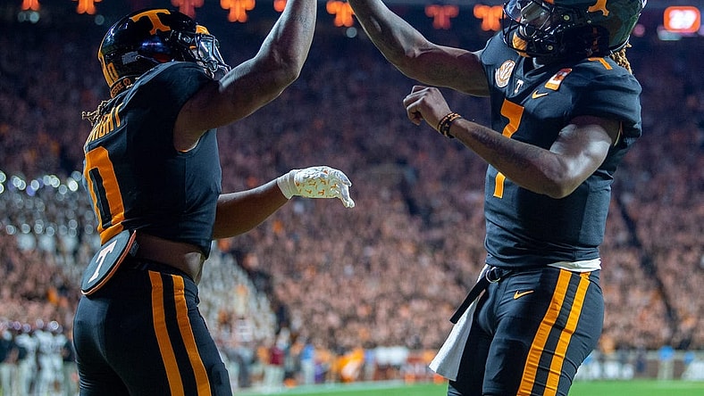 Tennessee running back Jaylen Wright (0) and quarterback Joe Milton III (7) celebrate Wright's touchdown during an NCAA college football game between Tennessee and South Carolina in Knoxville, Tenn., on Saturday, Sept. 30, 2023.