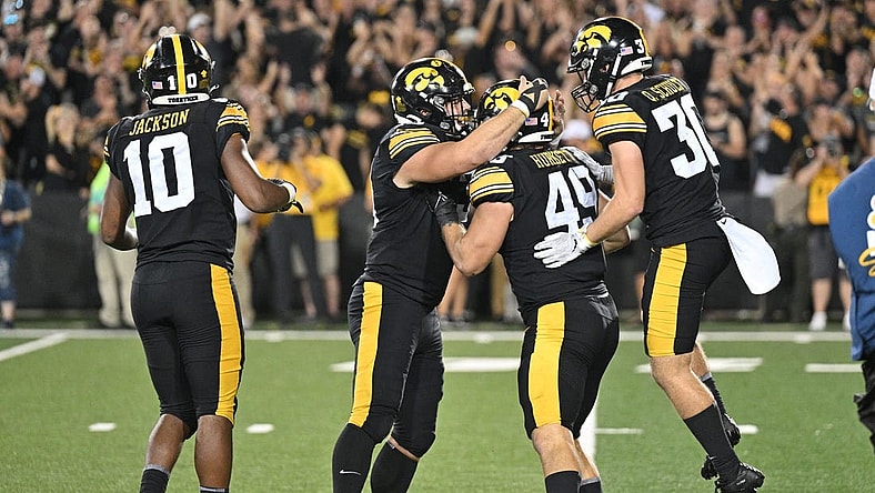 Sep 30, 2023; Iowa City, Iowa, USA; Iowa Hawkeyes defensive lineman Ethan Hurkett (49) and defensive back Quinn Schulte (30) and linebacker Nick Jackson (10) react during the fourth quarter against the Michigan State Spartans at Kinnick Stadium. Mandatory Credit: Jeffrey Becker-USA TODAY Sports