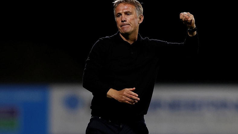 Wrexham manager Phil Parkinson celebrates winning a penalty shootout against Wigan Athletic at the Racecourse Ground in Wrexham, Wales, Britain on Aug. 8, 2023. (Action Images/Jason Cairnduff)