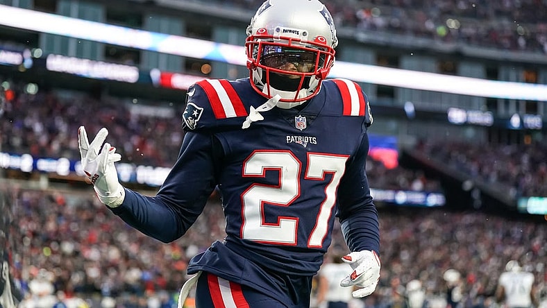 Nov 28, 2021; Foxborough, Massachusetts, USA; New England Patriots cornerback J.C. Jackson (27) reacts after intercepting a pass in the Tennessee Titans end zone in the second half at Gillette Stadium. Mandatory Credit: David Butler II-USA TODAY Sports