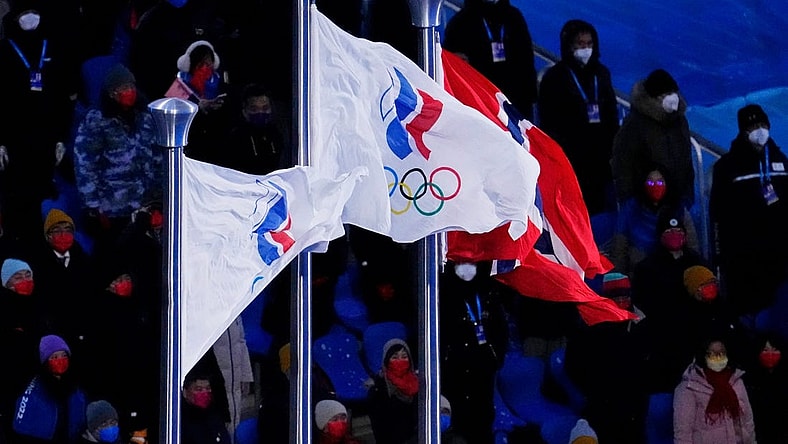 Feb 20, 2022; Beijing, CHINA; Two Russian Olympic Committee flags and the flag of Norway are displayed during the medal ceremony for the cross-country skiing men's 50km mass start during the closing ceremony for the Beijing 2022 Olympic Winter Games at Beijing National Stadium. Mandatory Credit: George Walker IV-USA TODAY Sports