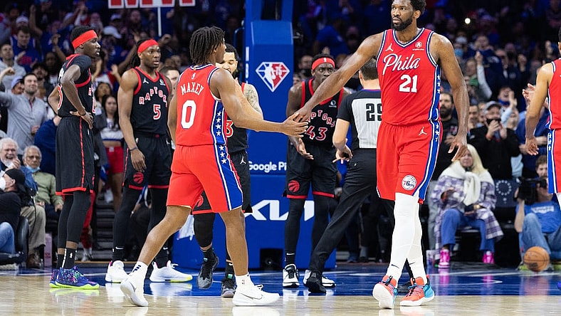 Apr 18, 2022; Philadelphia, Pennsylvania, USA; Philadelphia 76ers center Joel Embiid (21) reacts with guard Tyrese Maxey (0) after a score and one against the Toronto Raptors during the first quarter in game two of the first round for the 2022 NBA playoffs at Wells Fargo Center. Mandatory Credit: Bill Streicher-USA TODAY Sports