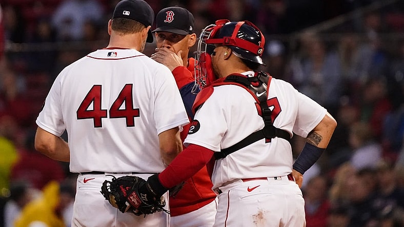 May 19, 2022; Boston, Massachusetts, USA; Boston Red Sox pitching coach Dave Bush (58) talks with starting pitcher Rich Hill (44) against the Seattle Mariners in the second inning at Fenway Park. Mandatory Credit: David Butler II-USA TODAY Sports
