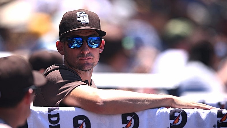 Jun 12, 2022; San Diego, California, USA; San Diego Padres acting manager Ryan Flaherty looks on from the dugout during the third inning against the Colorado Rockies at Petco Park. Mandatory Credit: Orlando Ramirez-USA TODAY Sports