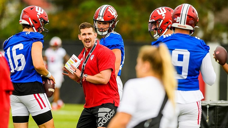 Offensive coordinator Walt Bell demonstrates the proper position during the first open practice of the 2022 season at the practice facility at Indiana University on Tuesday, August 2, 2022.

Iufb Oc Walt Bell Showing Position