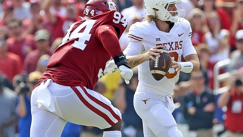 Oct 8, 2022; Dallas, Texas, USA;  Texas Longhorns quarterback Quinn Ewers (3) looks to throw as Oklahoma Sooners defensive lineman Isaiah Coe (94) chases during the game at the Cotton Bowl. Mandatory Credit: Kevin Jairaj-USA TODAY Sports