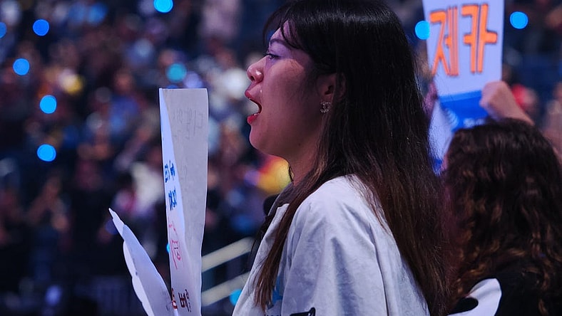 Nov 5, 2022; San Francisco, California, USA;  A DRX fan with visible tears after DRX won the League of Legends World Championships against T1 at Chase Center. Mandatory Credit: Kelley L Cox-USA TODAY Sports