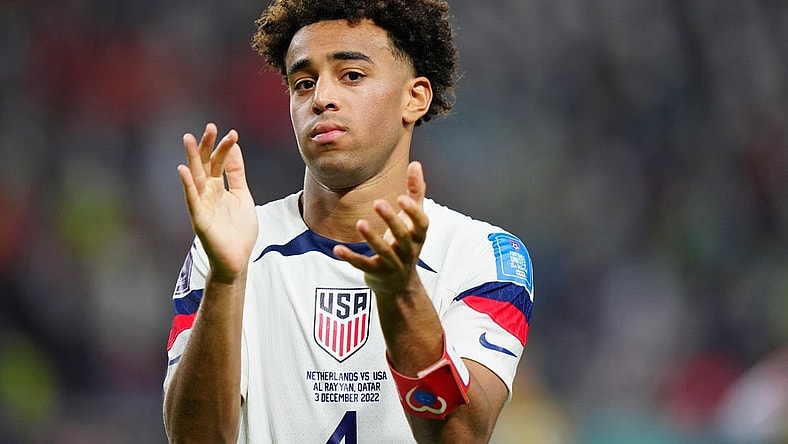 Dec 3, 2022; Al Rayyan, Qatar; United States of America midfielder Tyler Adams (4) acknowledges fans after losing a round of sixteen match against the Netherlands in the 2022 FIFA World Cup at Khalifa International Stadium. Mandatory Credit: Danielle Parhizkaran-USA TODAY Sports