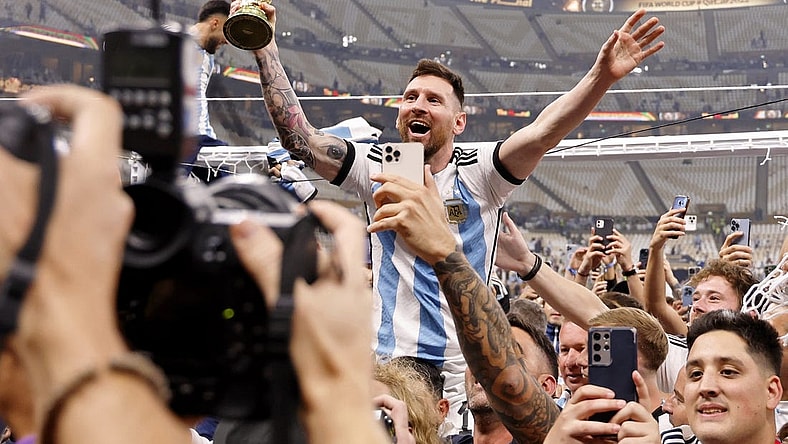 Dec 18, 2022; Lusail, Qatar; Argentina forward Lionel Messi (10) celebrates with fans after winning the 2022 World Cup final against France at Lusail Stadium. Mandatory Credit: Yukihito Taguchi-USA TODAY Sports