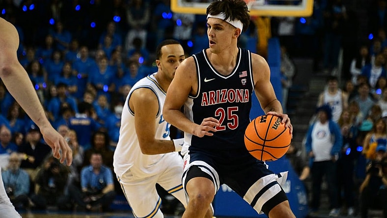 Mar 4, 2023; Los Angeles, California, USA; Arizona Wildcats guard Kerr Kriisa (25) controls the ball as UCLA Bruins defends during the first half at Pauley Pavilion presented by Wescom. Mandatory Credit: Richard Mackson-USA TODAY Sports