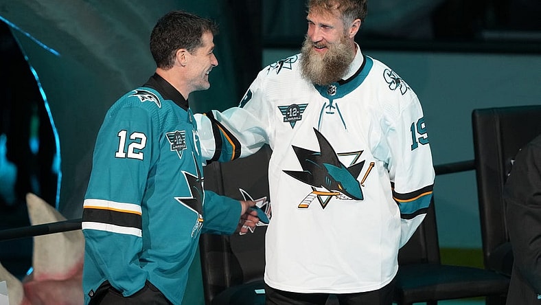 Feb 25, 2023; San Jose, California, USA; San Jose Sharks former player Patrick Marleau talks to former player Joe Thornton during his jersey retirement ceremony before the game against the Chicago Blackhawks at SAP Center at San Jose. Mandatory Credit: Darren Yamashita-USA TODAY Sports