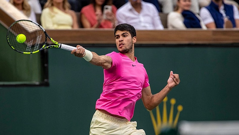 Carlos Alcaraz of Spain hits to Daniil Medvedev of Russia during the men's singles final at the BNP Paribas Open of the Indian Wells Tennis Garden in Indian Wells, Calif., Sunday, March 19, 2023.