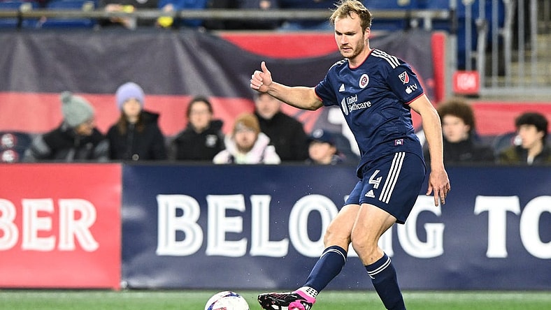 Mar 18, 2023; Foxborough, Massachusetts, USA; New England Revolution defender Henry Kessler (4) kicks the ball against the Nashville SC during the first half at Gillette Stadium. Mandatory Credit: Brian Fluharty-USA TODAY Sports