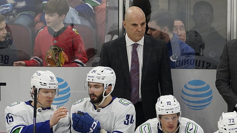 Mar 26, 2023; Chicago, Illinois, USA; Vancouver Canucks head coach Rick Tocchet stands behind the bench during the first period at United Center. Mandatory Credit: David Banks-USA TODAY Sports