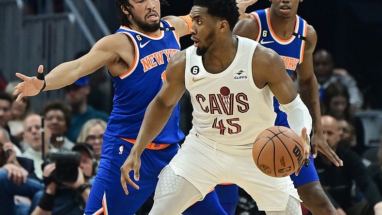 Mar 31, 2023; Cleveland, Ohio, USA; Cleveland Cavaliers guard Donovan Mitchell (45) is defended by New York Knicks guard Jalen Brunson (11) during the first half at Rocket Mortgage FieldHouse. Mandatory Credit: Ken Blaze-USA TODAY Sports