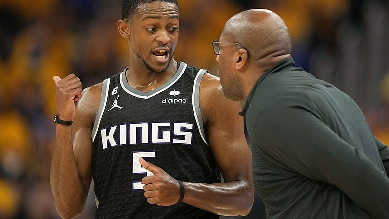 Apr 23, 2023; San Francisco, California, USA; Sacramento Kings guard De'Aaron Fox (5) talks to head coach Mike Brown during the second quarter of game four of the 2023 NBA playoffs against the Golden State Warriors at Chase Center. Mandatory Credit: Darren Yamashita-USA TODAY Sports