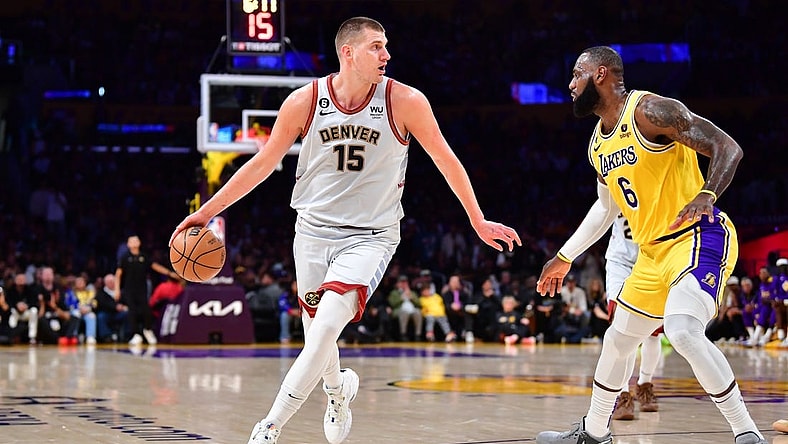 May 22, 2023; Los Angeles, California, USA; Denver Nuggets center Nikola Jokic (15) drives to the basket against Los Angeles Lakers forward LeBron James (6) during the second quarter in game four of the Western Conference Finals for the 2023 NBA playoffs at Crypto.com Arena. Mandatory Credit: Gary A. Vasquez-USA TODAY Sports