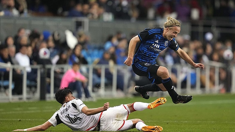 May 27, 2023; San Jose, California, USA; San Jose Earthquakes forward Tommy Thompson (right) leaps after a tackle by FC Dallas defender Marco Farfan (4) during the second half at PayPal Park. Mandatory Credit: Darren Yamashita-USA TODAY Sports