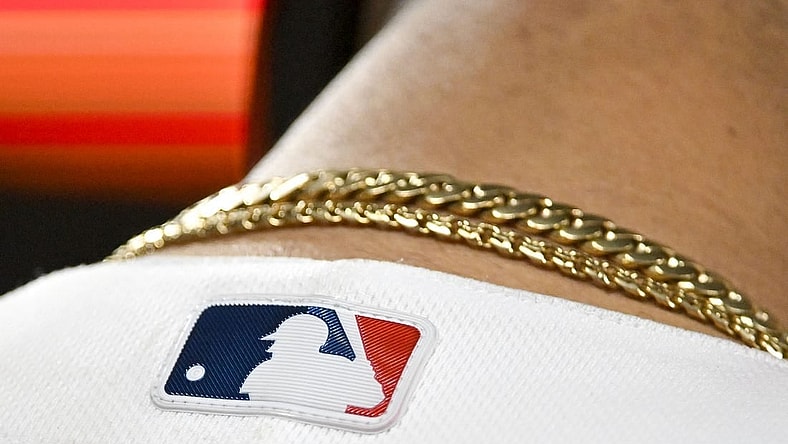 Jun 12, 2023; St. Louis, Missouri, USA;  A detailed view of the MLB logo on the back of St. Louis Cardinals catcher Willson Contreras (40) jersey during the eighth inning against the San Francisco Giants at Busch Stadium. Mandatory Credit: Jeff Curry-USA TODAY Sports