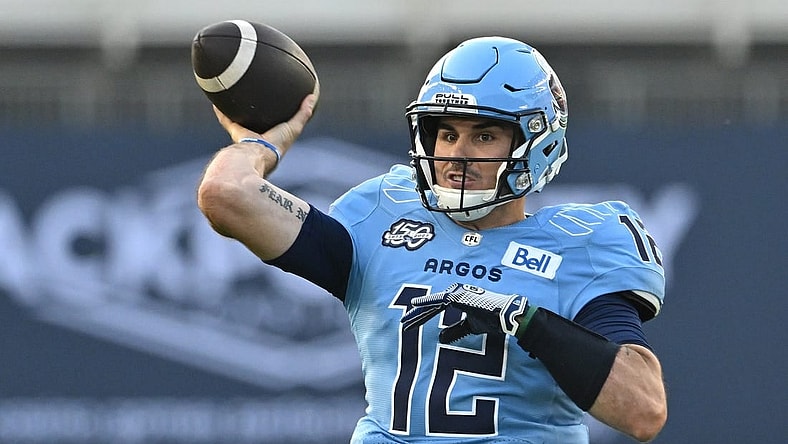 Jun 18, 2023; Toronto, Ontario, CAN;  Toronto Argonauts quarterback Chad Kelly (12) throws a pass against the Hamilton Tiger-Cats in the second quarter at BMO Field. Mandatory Credit: Dan Hamilton-USA TODAY Sports