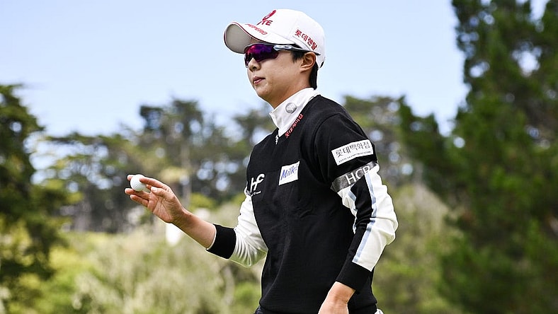 Jul 9, 2023; Pebble Beach, California, USA; Hyo Joo Kim acknowledges the crowd after her putt on the second hole  during the final round of the U.S. Women's Open golf tournament at Pebble Beach Golf Links. Mandatory Credit: Kelvin Kuo-USA TODAY Sports