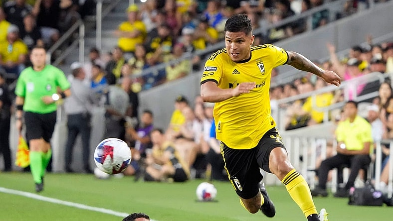 Jul 31, 2023; Columbus, OH, USA; Columbus Crew forward Cucho Hernandez (9) gets around the sliding tackle of Club America midfielder Richard Sanchez (20) during the first half of the League Cup group match at Lower.com Field.
