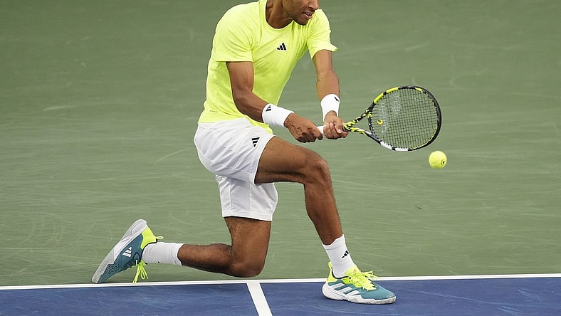 Aug 8, 2023; Toronto, Ontario, Canada; Felix Auger-Aliassime (CAN) hits a ball to Max Purcell (not pictured) at Sobeys Stadium. Mandatory Credit: John E. Sokolowski-USA TODAY Sports