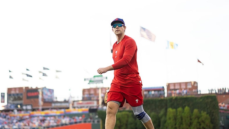 Aug 8, 2023; Philadelphia, Pennsylvania, USA; Philadelphia Phillies Rhys Hoskins walks the field while on injured reserve before a game against the Washington Nationals at Citizens Bank Park. Mandatory Credit: Bill Streicher-USA TODAY Sports