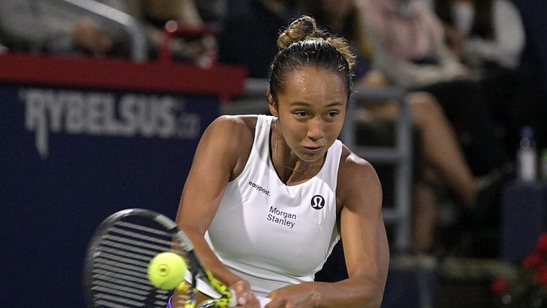 Aug 10, 2023; Montreal, Quebec, Canada; Leylah Fernandez (CAN) hits a backhand against Danielle Collins (USA) (not pictured) during third round play at IGA Stadium. Mandatory Credit: Eric Bolte-USA TODAY Sports