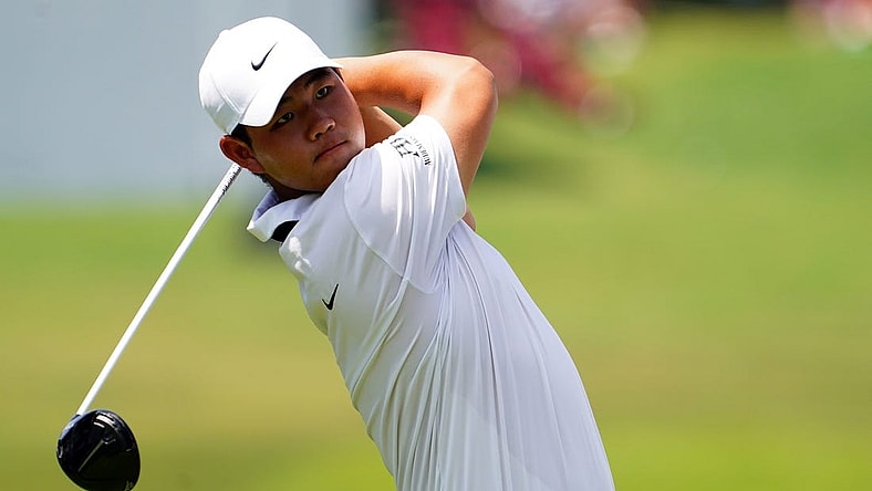 Aug 26, 2023; Atlanta, Georgia, USA; Tom Kim plays his shot from the fourth tee during the third round of the TOUR Championship golf tournament at East Lake Golf Club. Mandatory Credit: John David Mercer-USA TODAY Sports