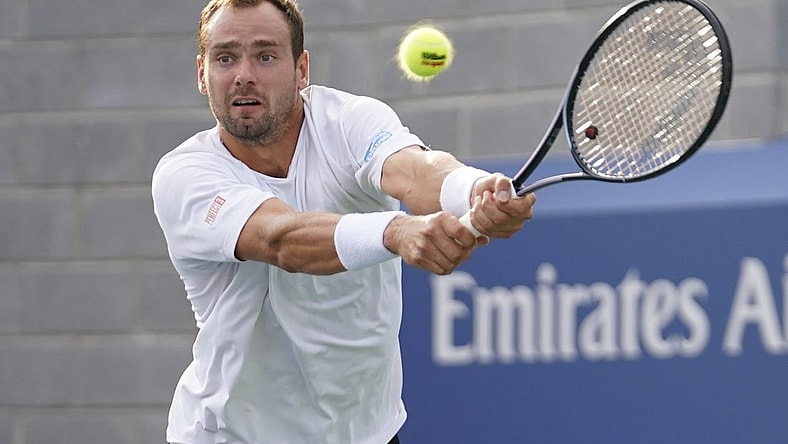 Aug 30, 2023; Flushing, NY, USA; Roman Safiullin hits to Tommy Paul of the United States on day three of the 2023 U.S. Open tennis tournament at USTA Billie Jean King National Tennis Center. Mandatory Credit: Danielle Parhizkaran-USA TODAY Sports