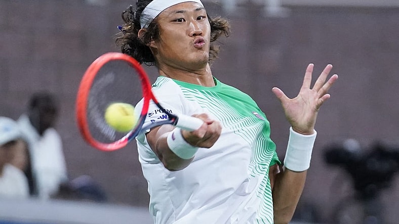Aug 30, 2023; Flushing, NY, USA; Zhizhen Zhang of China hits to Casper Ruud of Norway on day three of the 2023 U.S. Open Tennis Championships at USTA Billie Jean King National Tennis Center. Mandatory Credit: Danielle Parhizkaran-USA TODAY Sports