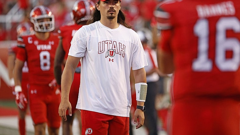 Aug 31, 2023; Salt Lake City, Utah, USA; Utah Utes quarterback Cameron Rising (7), out with an injury warms his quarterback up at halftime against the Florida Gators at Rice-Eccles Stadium. Mandatory Credit: Jeff Swinger-USA TODAY Sports