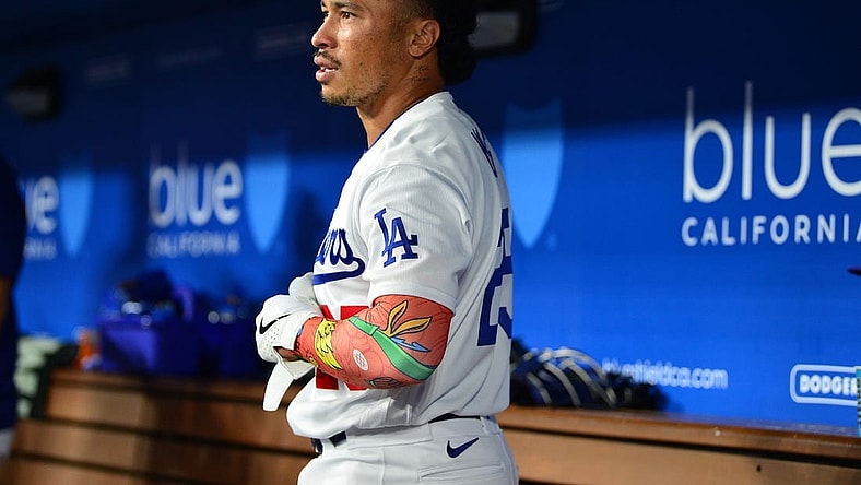 September 1, 2023; Los Angeles, California, USA; Los Angeles Dodgers second baseman Kolten Wong (25) reacts after hitting a three run home run against the Atlanta Braves during the eighth inning at Dodger Stadium. Mandatory Credit: Gary A. Vasquez-USA TODAY Sports