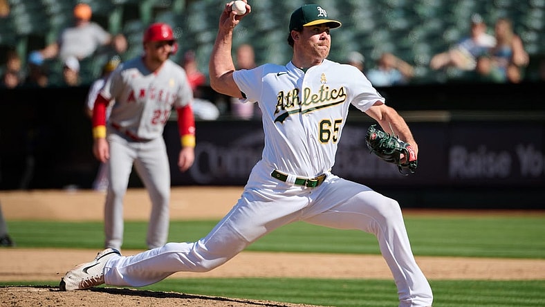 Sep 3, 2023; Oakland, California, USA; Oakland Athletics pitcher Trevor May (65) throws a pitch against the Los Angeles Angels during the ninth inning at Oakland-Alameda County Coliseum. Mandatory Credit: Robert Edwards-USA TODAY Sports
