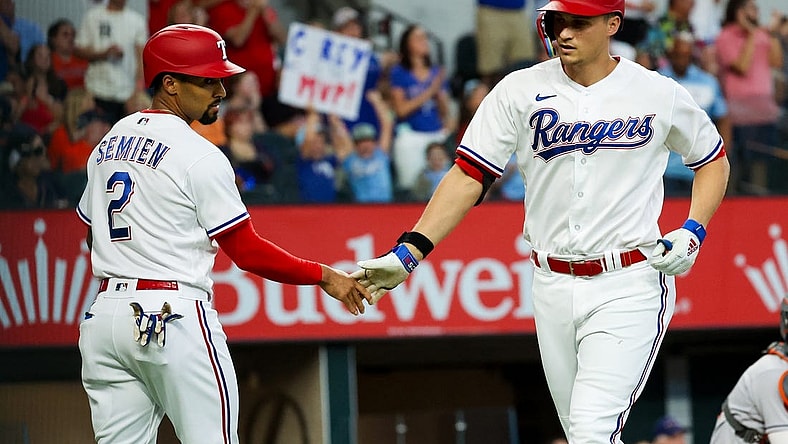 Sep 4, 2023; Arlington, Texas, USA;  Texas Rangers shortstop Corey Seager (5) celebrates with Texas Rangers second baseman Marcus Semien (2) after hitting a two run home run during the first inning against the Houston Astros at Globe Life Field. Mandatory Credit: Kevin Jairaj-USA TODAY Sports