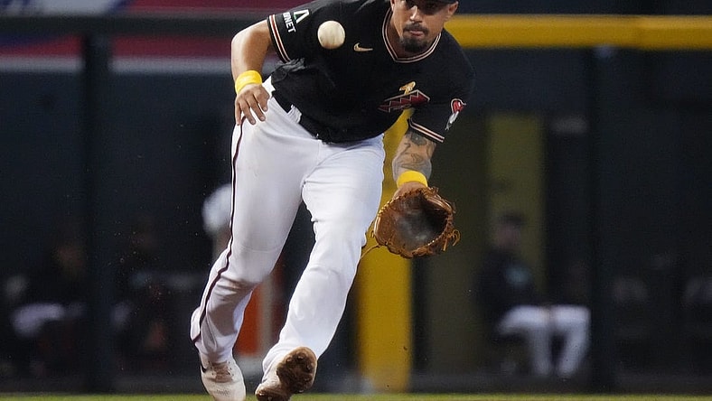 Arizona Diamondbacks' Jace Peterson (6) fields a ground ball at third base against the Baltimore Orioles at Chase Field in Phoenix on Sept. 3, 2023.