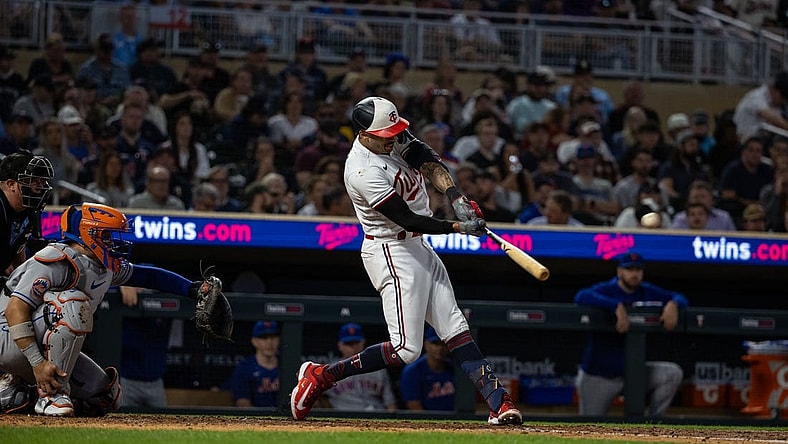 Sep 8, 2023; Minneapolis, Minnesota, USA; Minnesota Twins shortstop Carlos Correa (4) hits a solo home run during the fourth inning against the New York Mets at Target Field. Mandatory Credit: Jordan Johnson-USA TODAY Sports