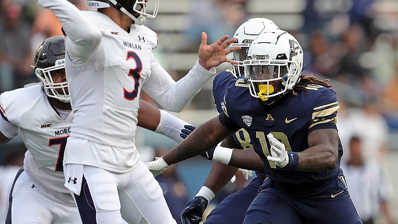 Akron linebacker Antavious Fish closes in on Morgan State quarterback Carson Baker in the first half, Saturday, Sept. 9, 2023.