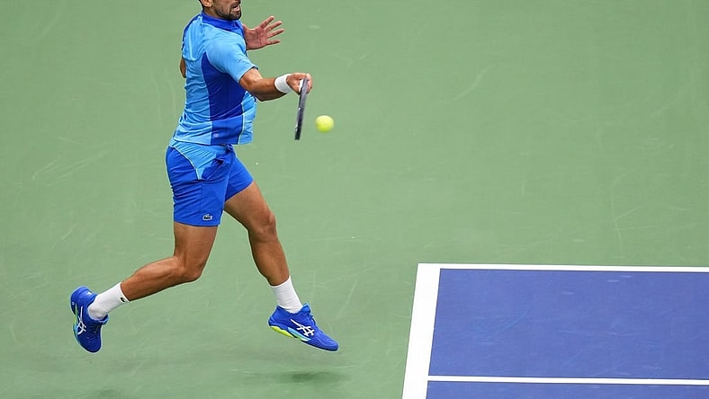 Sep 10, 2023; Flushing, NY, USA; Novak Djokovic of Serbia hits a forehand against Daniil Medvedev (not pictured) in the men's singles final in the men's singles final on day fourteen of the 2023 U.S. Open tennis tournament at USTA Billie Jean King National Tennis Center. Mandatory Credit: Danielle Parhizkaran-USA TODAY Sports