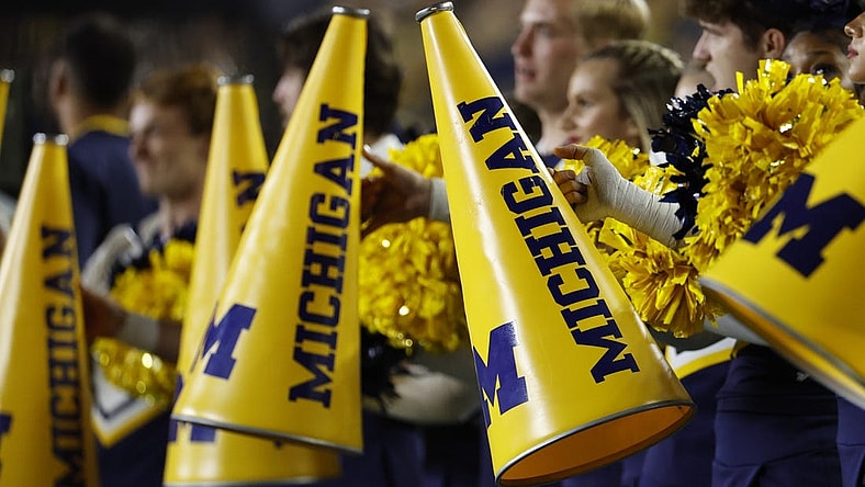 Sep 16, 2023; Ann Arbor, Michigan, USA;  Michigan Wolverines cheerleader megaphone during the first half against the Bowling Green Falcons at Michigan Stadium. Mandatory Credit: Rick Osentoski-USA TODAY Sports