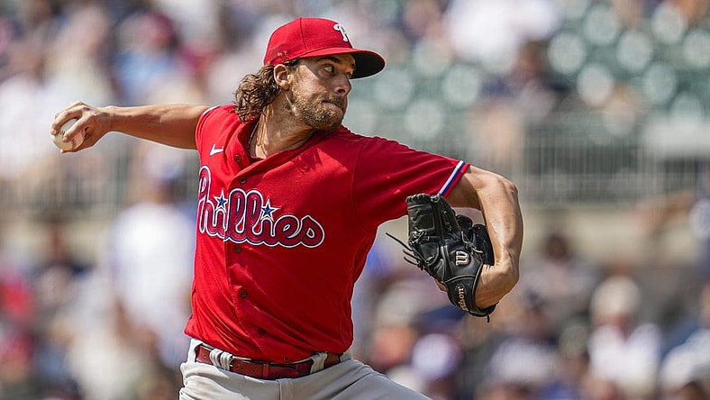 Sep 20, 2023; Cumberland, Georgia, USA; Philadelphia Phillies starting pitcher Aaron Nola (27) pitches against the Atlanta Braves during the first inning  at Truist Park. Mandatory Credit: Dale Zanine-USA TODAY Sports